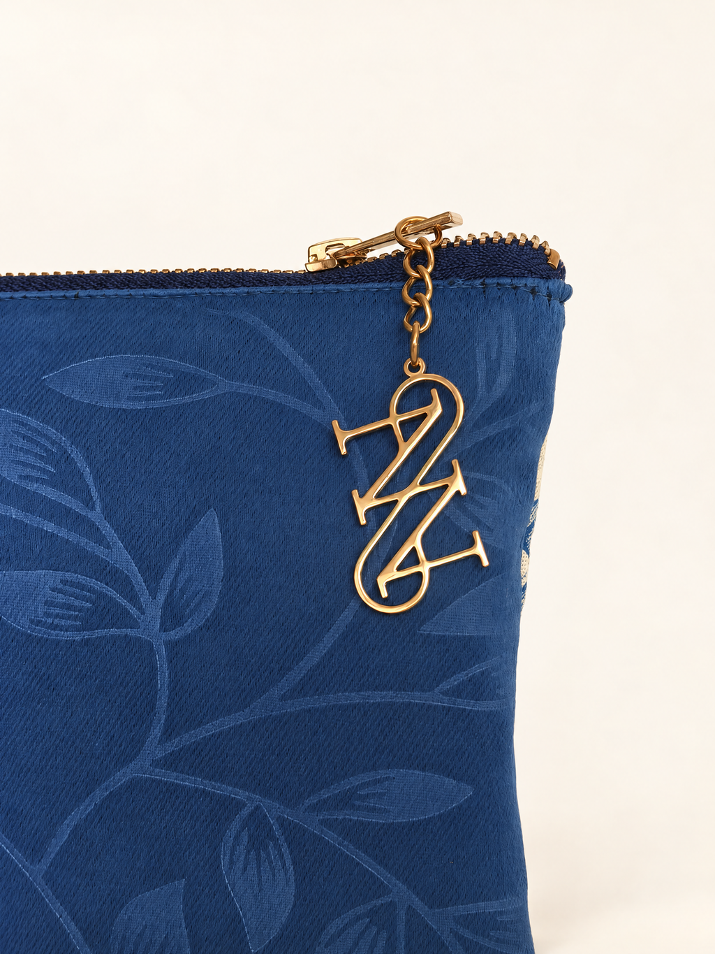 Camelia Pouch, Blue · Edition of 8, embossed leaf fabric and gold charm detail, Anne Sidora