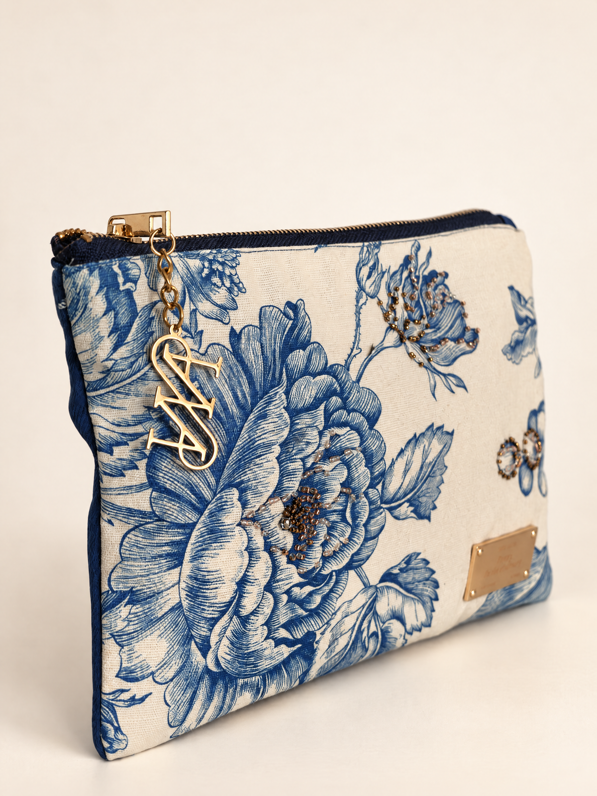 Camelia Pouch, Blue · Edition of 8, three quarter view with gold AS charm, Anne Sidora