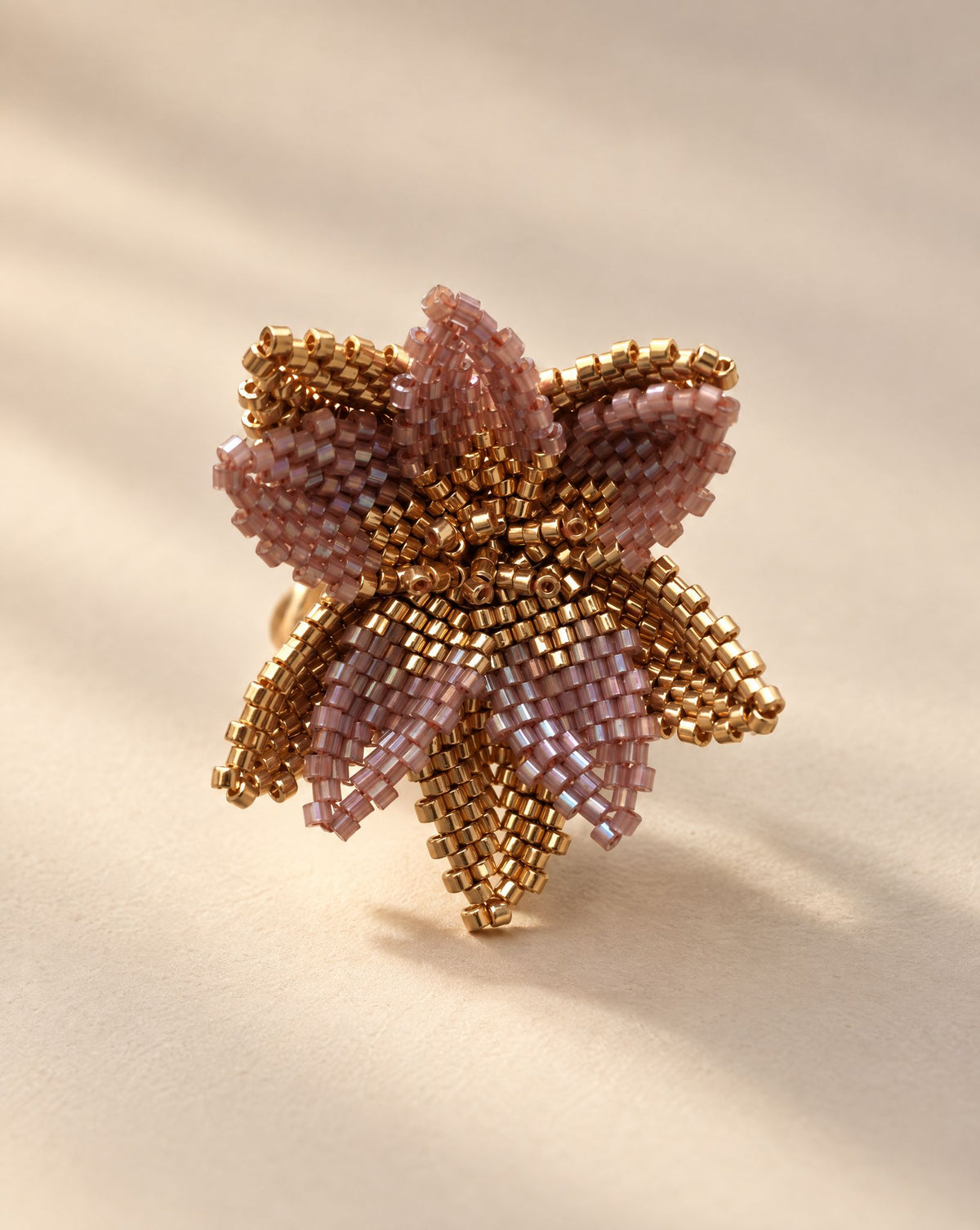 Flor del Alba Violet Ring side view, layered beaded petals on adjustable gold plated band, handmade by Anne Sidora