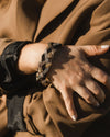 Quinta Luz beaded bracelet in gold and black on a wrist