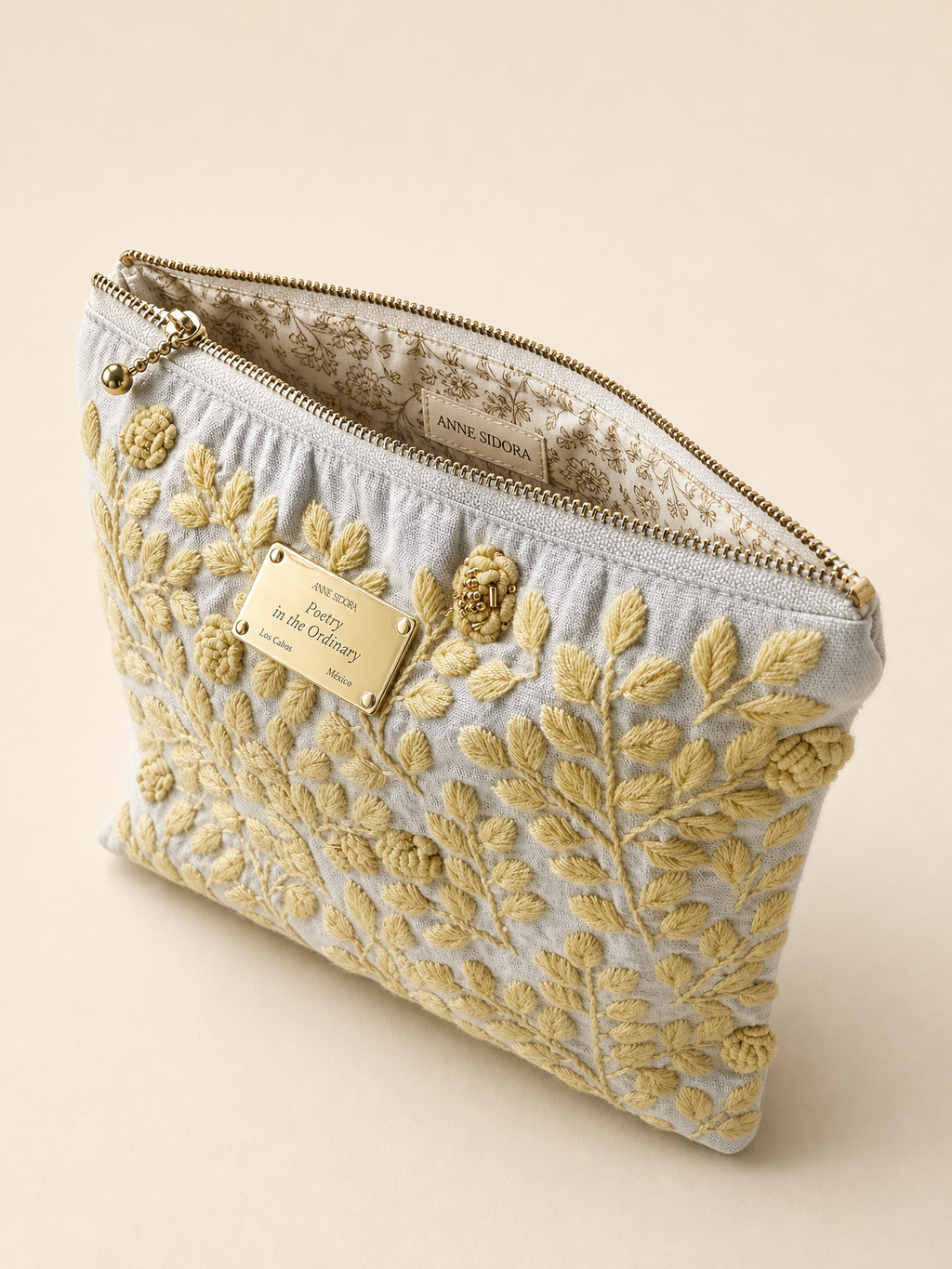 Rosa de Día embroidered pouch open showing printed cotton lining