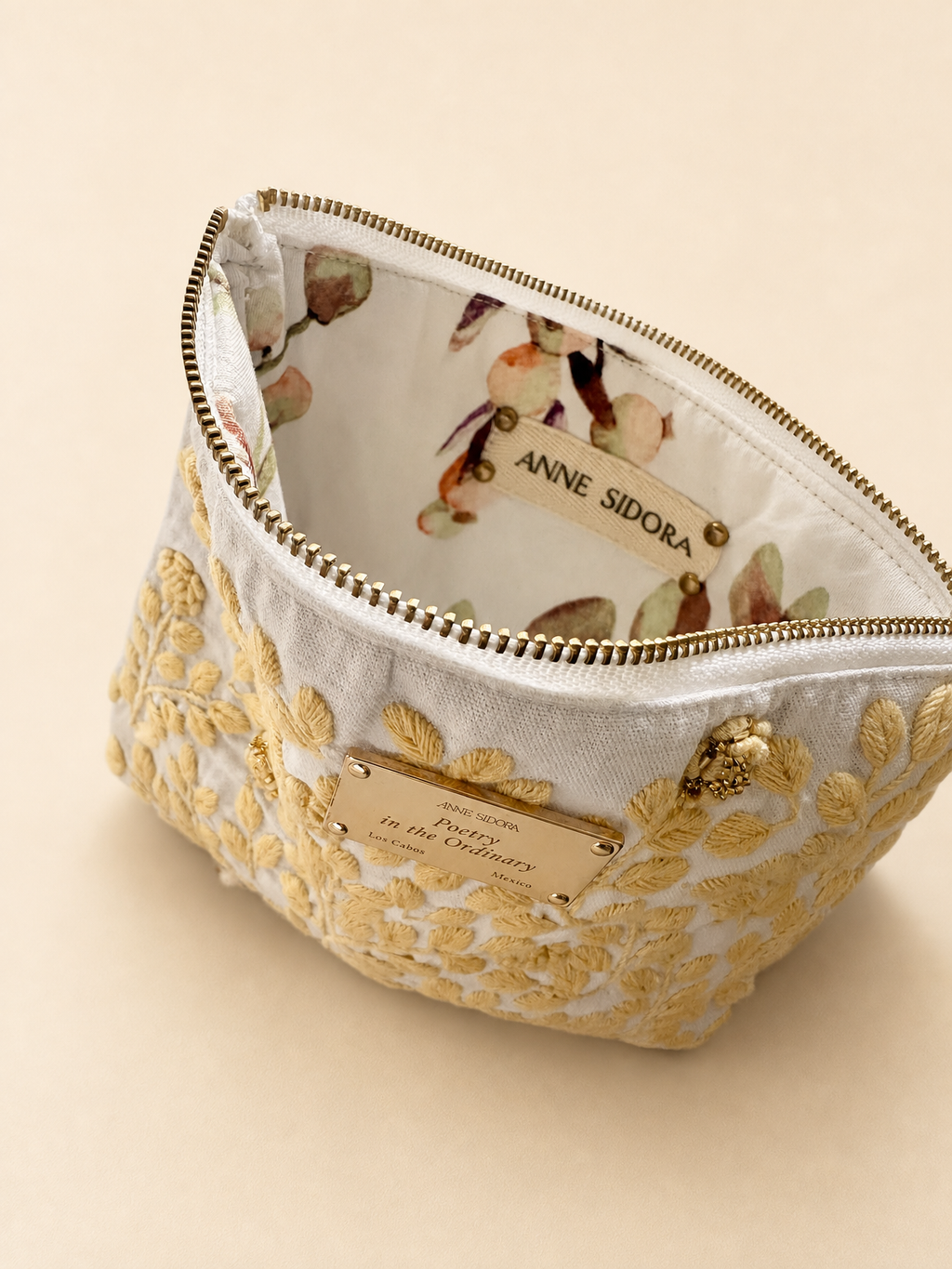 Rosa de Día embroidered pouch in butter yellow with gold plaque, Anne Sidora